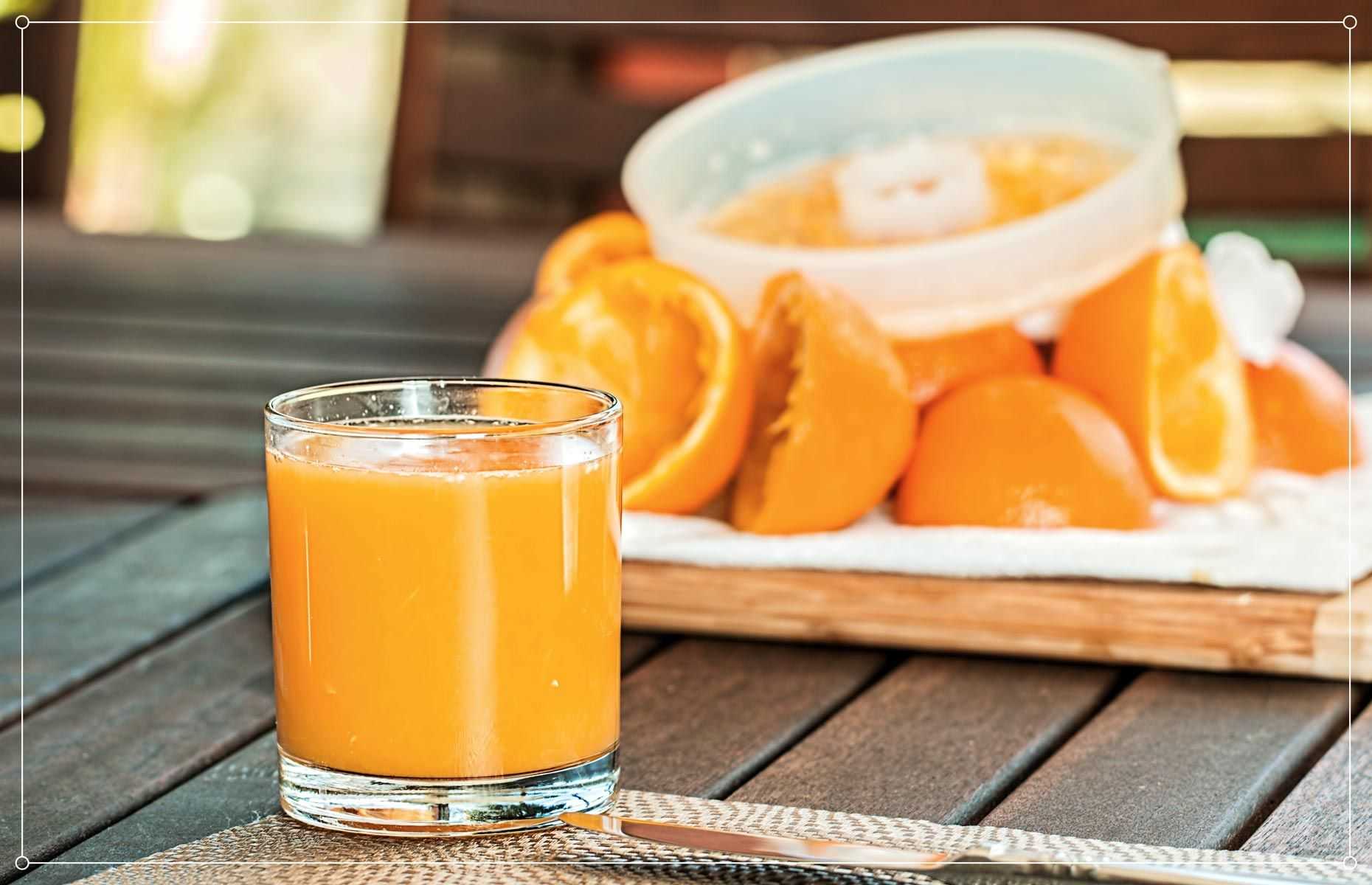 Glass of orange juice as an example of a food that may cause fructose intolerance symptoms