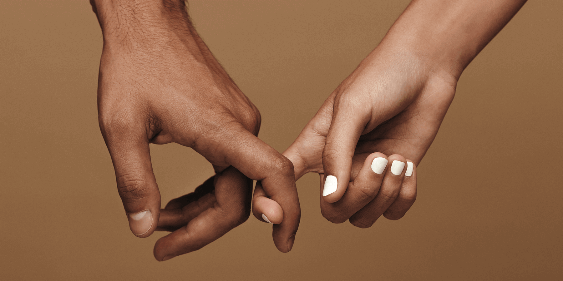 Couple holding hands and breaking stigma of living with an STD