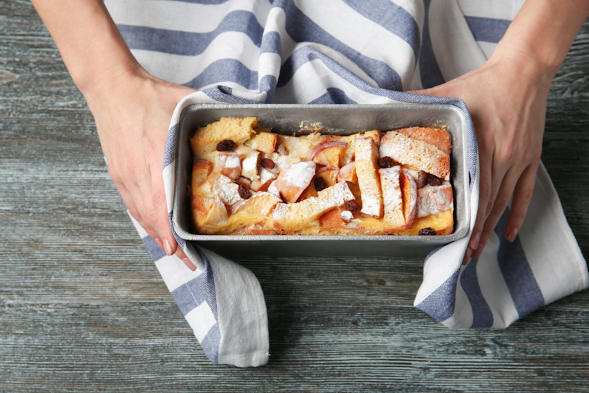 hands holding baked good