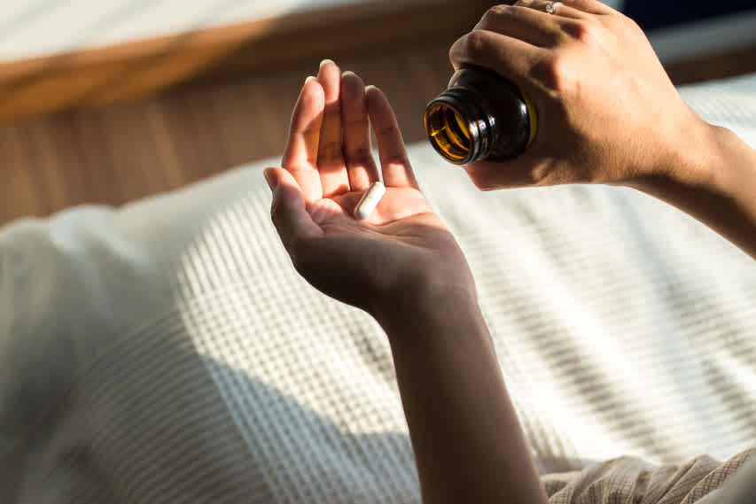 open hand with pill