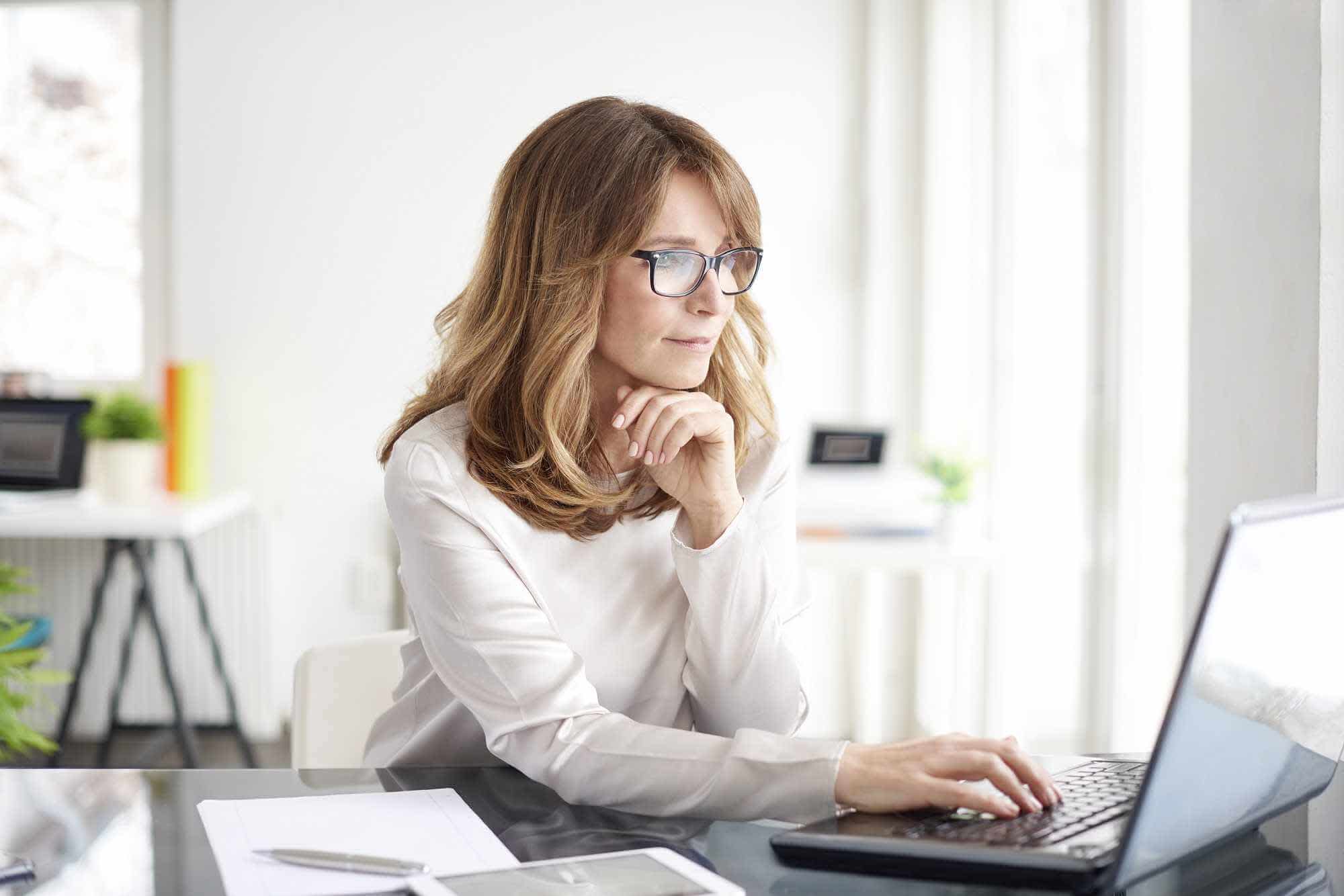 Woman using laptop to learn what cephalexin is used for