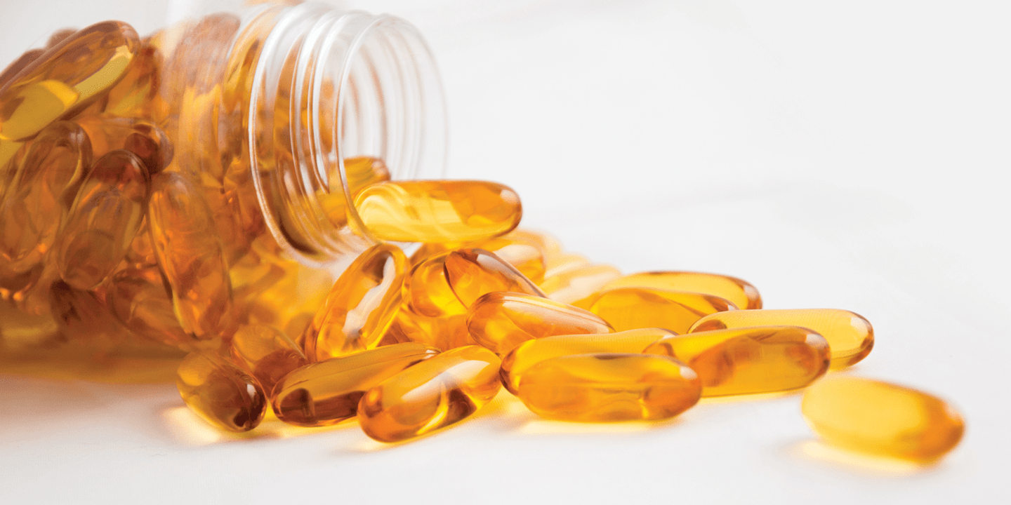 Open bottle of fish oil supplements with EPA and DHA