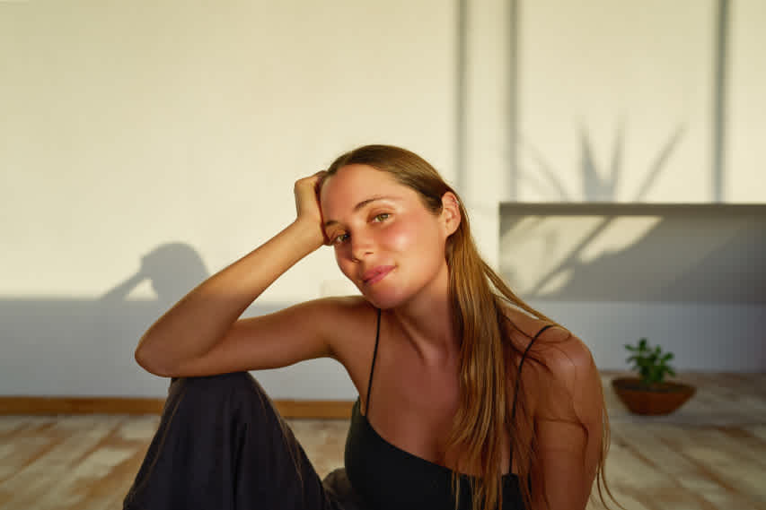 woman sitting on the floor in soft light