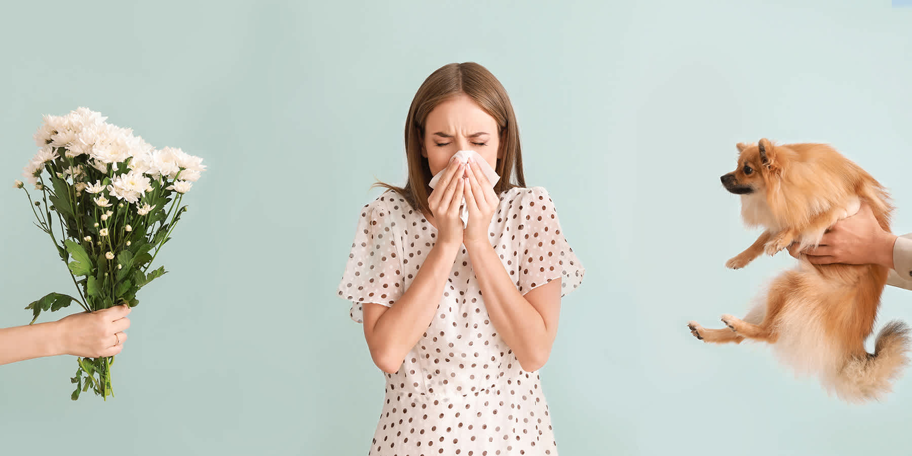 Woman sneezing into tissue because of allergy symptoms