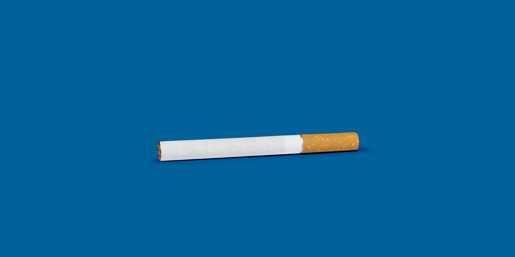 Cigarette against a blue background to represent smoking affecting fertility