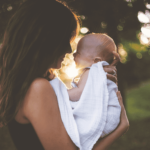 Woman holding her baby and wondering if HIV can be transmitted through breast milk