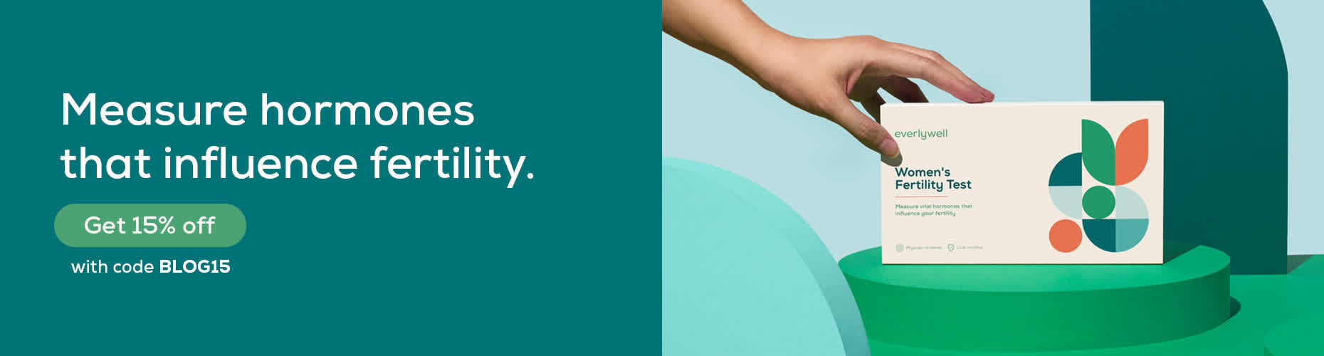 Person reaching for Everlywell Women's Fertility Test