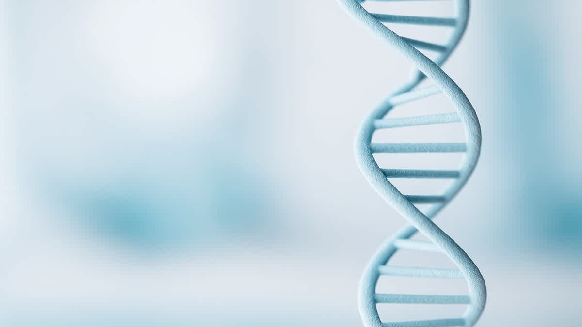 Close-up of a light blue DNA double helix against a soft white and teal background, representing genetic testing and cancer prevention.