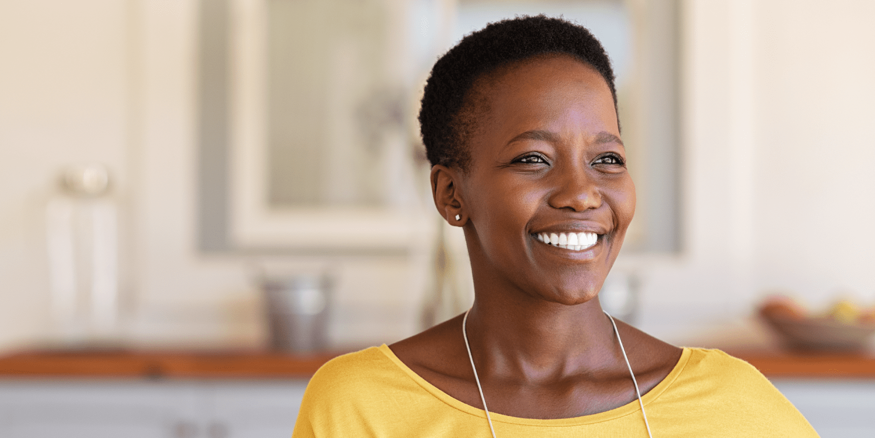 Woman smiling after receiving remote patient monitoring for diabetes