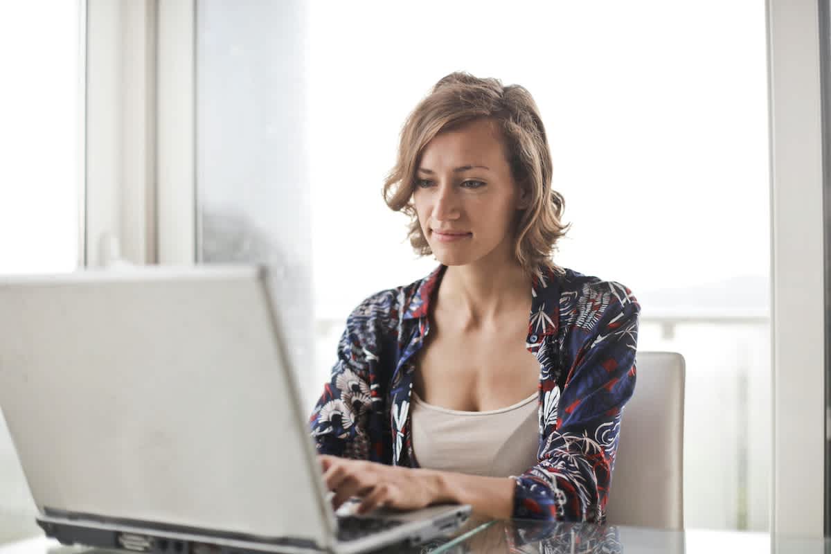 a woman reviewing test results on her laptop