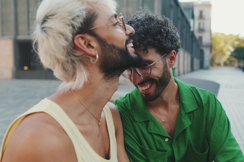 two men sitting and laughing