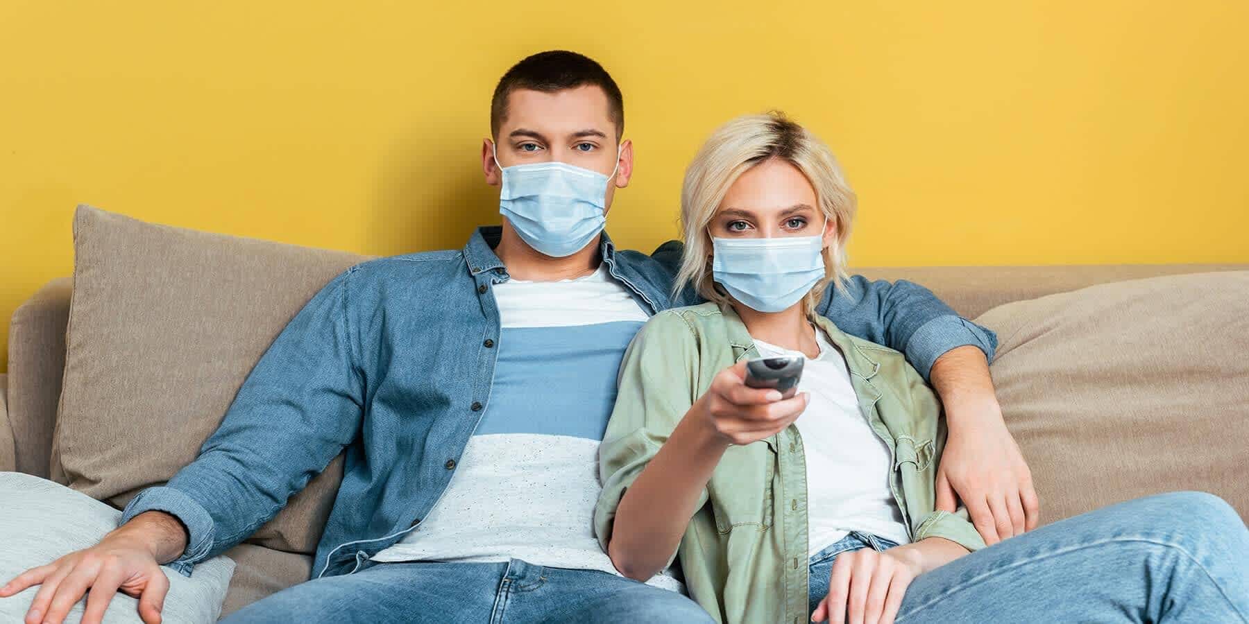 Couple about to watch television after discussing peeing after sex and why it's important