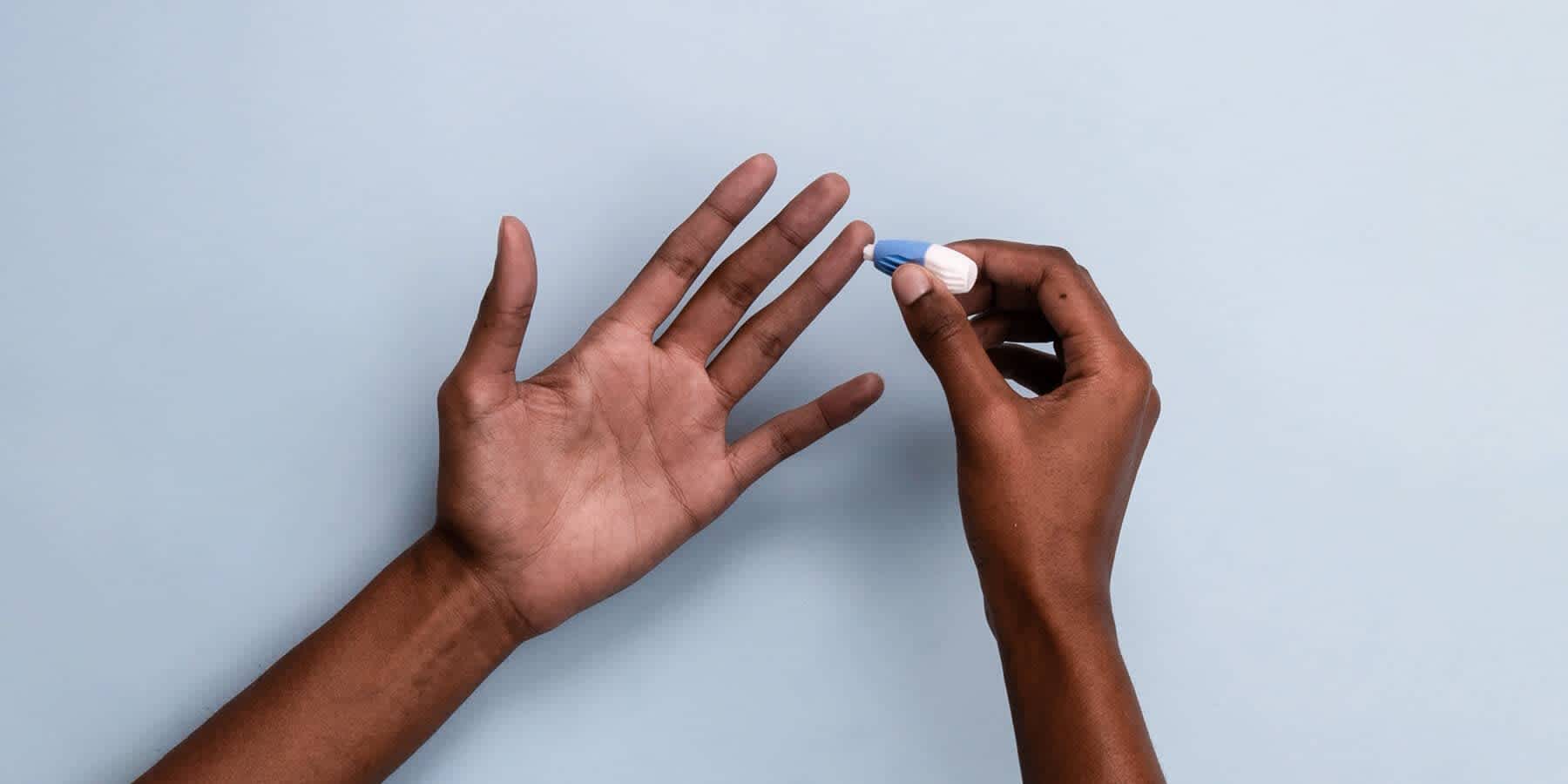 Person collecting sample for blood test