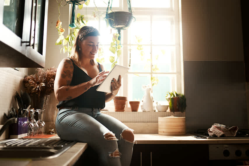 woman sitting on kitchen counter