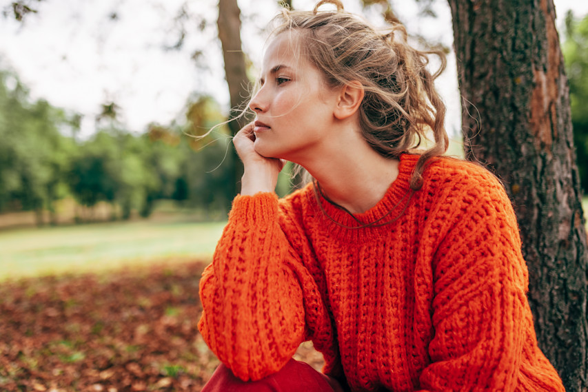 woman looking serious in sweater