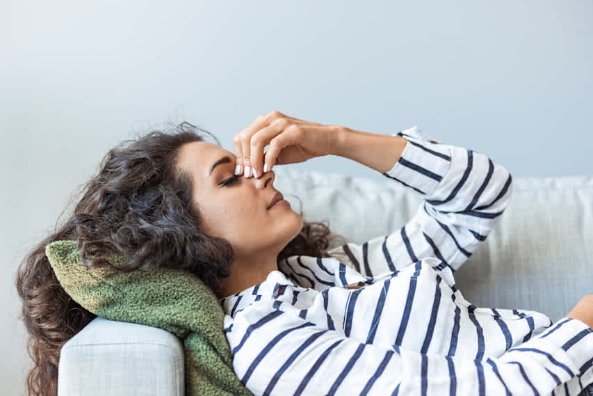 woman laying down in pain
