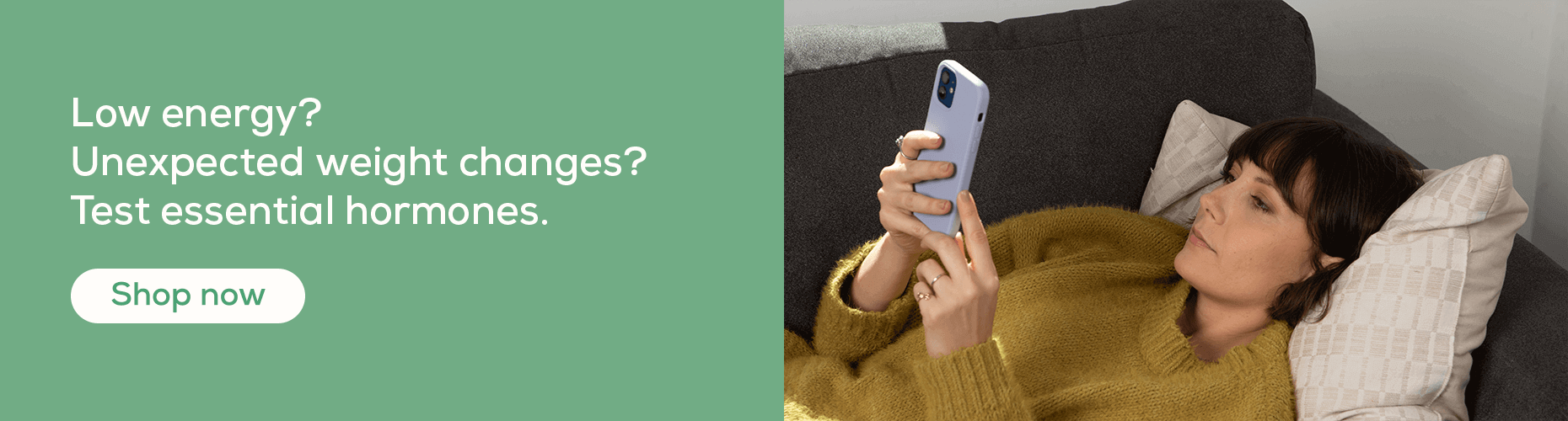 Woman looking at Women's Health Test digital results with mobile phone