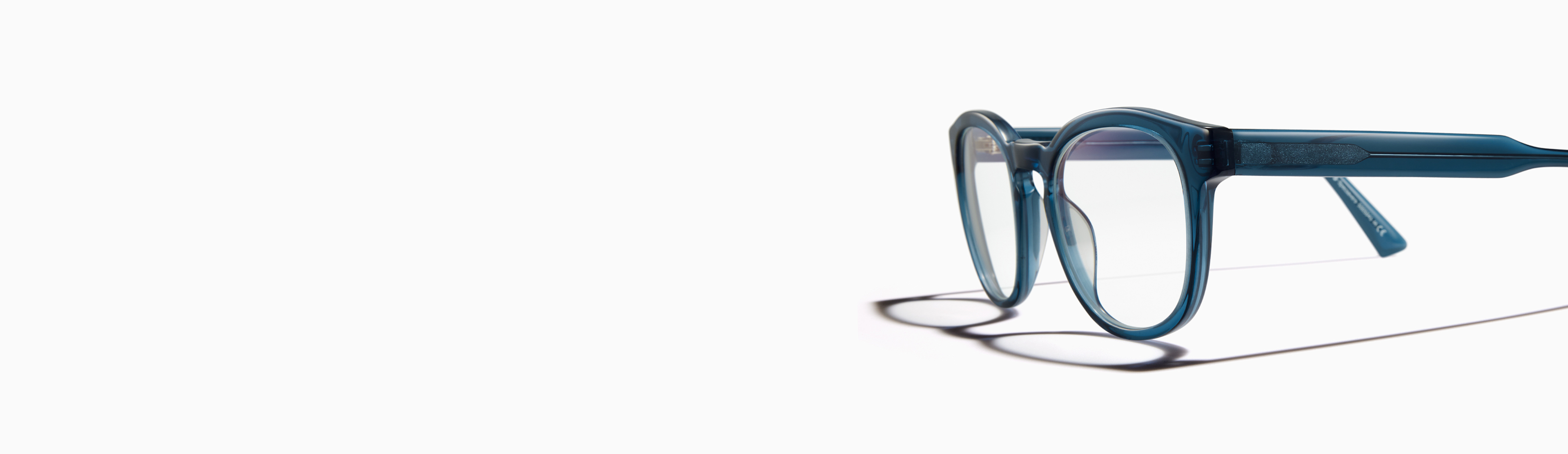 A pair of blue-rimmed eyeglasses with clear lenses.