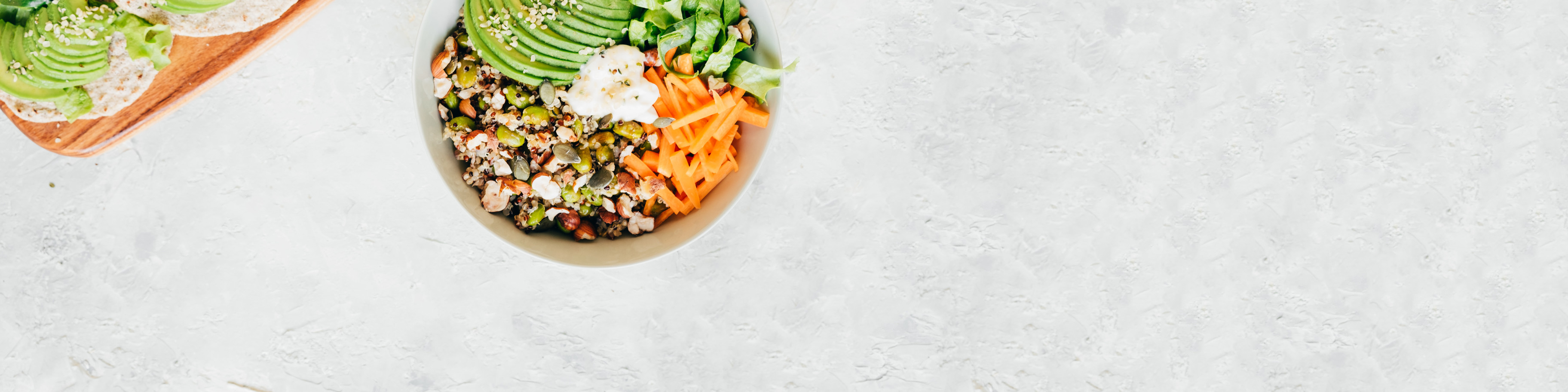 Bowl full of veggies and complete protein foods.