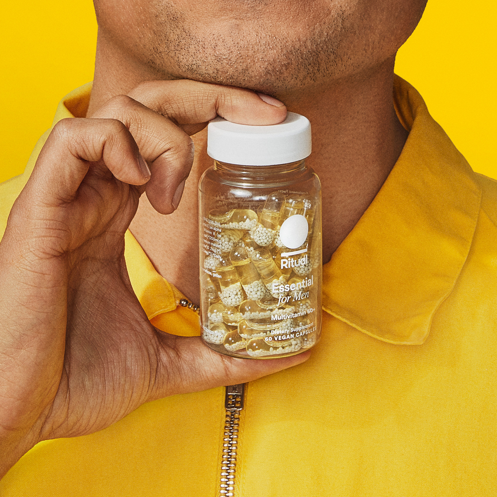 Man holding Ritual's Essential for Men 50+