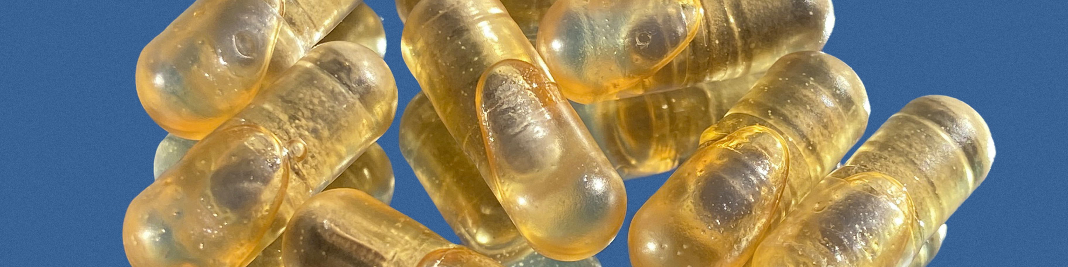 Several prenatal vitamin capsules.
