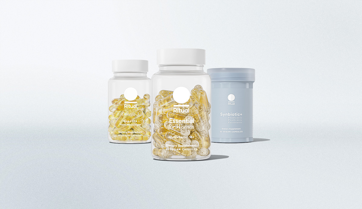 Bottle of Multivitamin in foreground with Omega-3 and Synbiotic+ in background