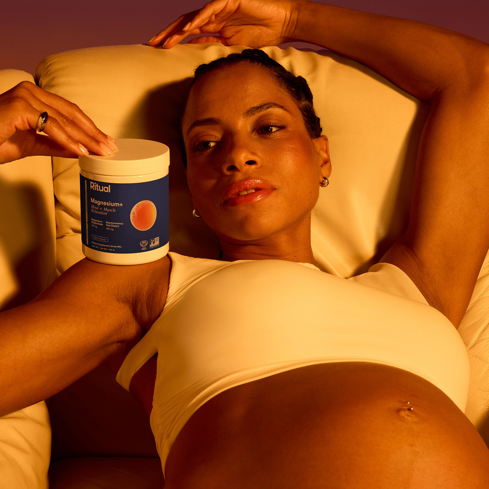 Pregnant person holds Ritual Magnesium+.