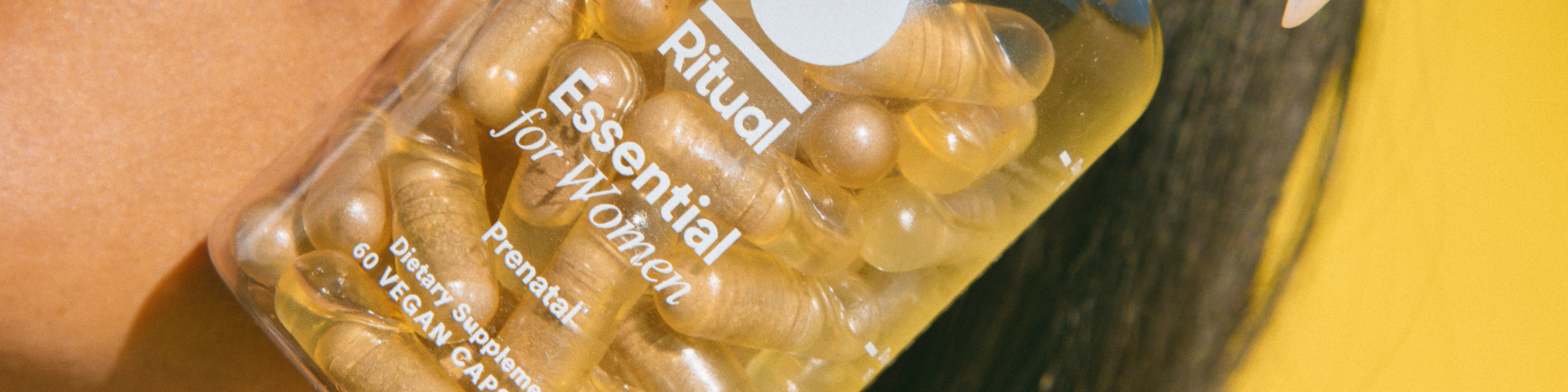 Closeup of an Essential Prenatal multivitamin bottle