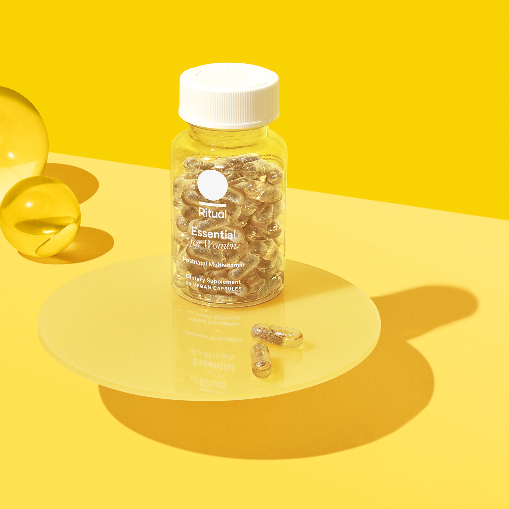 Bottle of EPOST Citrus on a yellow background with yellow props.