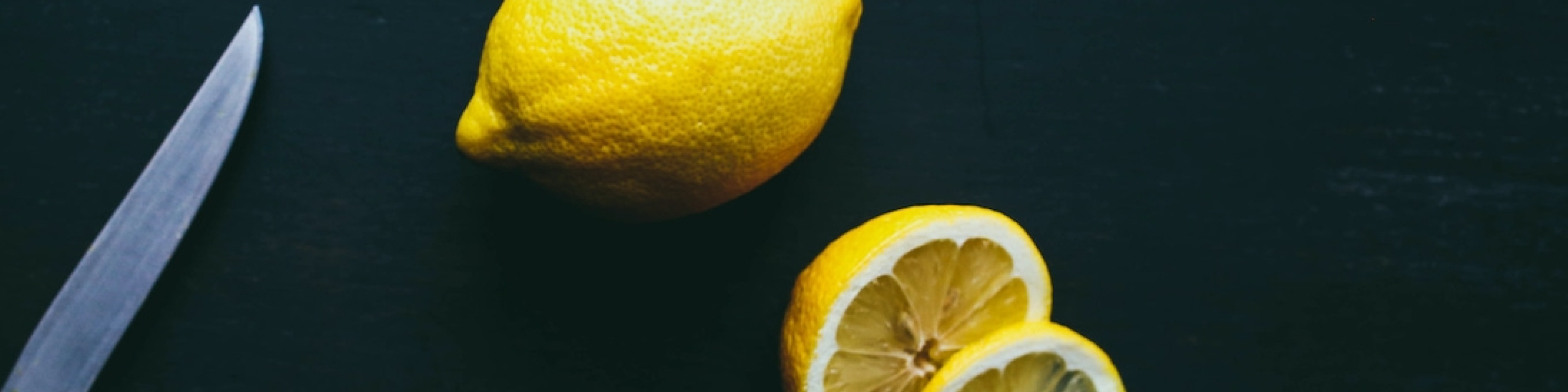Lemons on a cutting board.