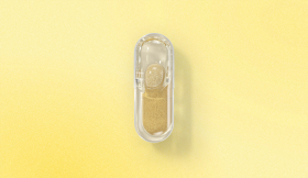 Ritual Essential Prenatal capsule on a yellow background