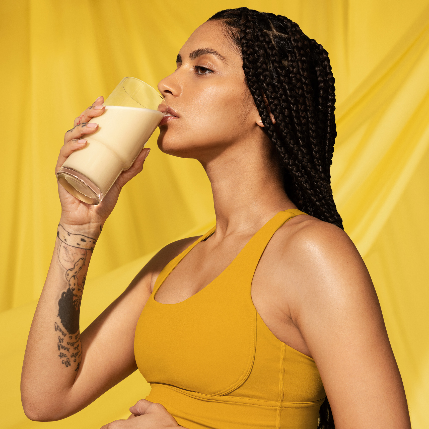 Model drinking glass of Ritual Daily Shake Pregnancy & Postpartum Protein mixture