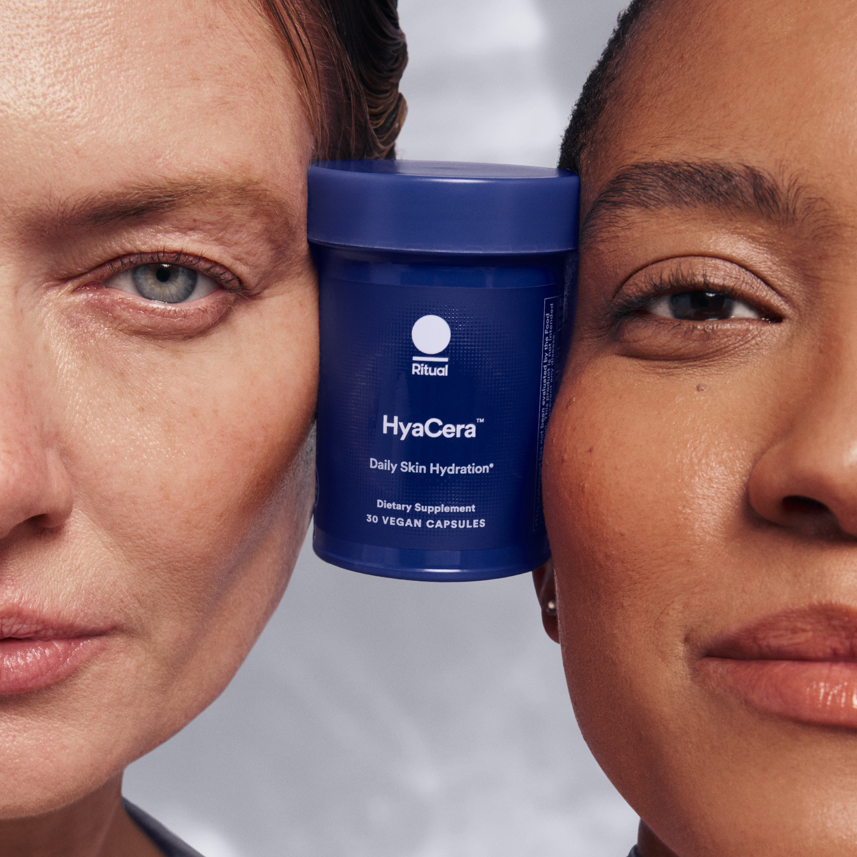 Two models faces with a bottle of HyaCera between them.