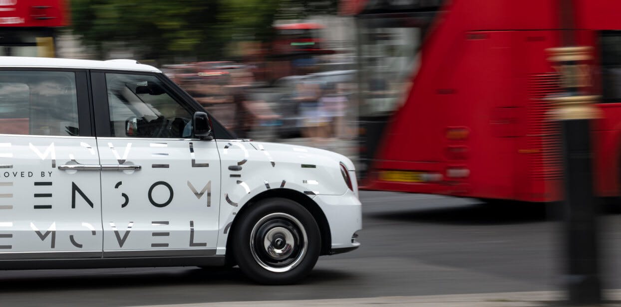 A taxi driving through London