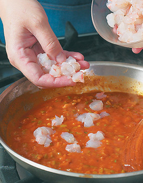 Peel and devein the shrimp, then dice them into small pieces so more can fit inside each filet.