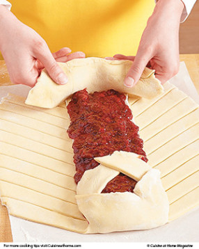 Fold flaps on both ends of the braid up and over the filling. Tuck in the excess dough like bed sheets.