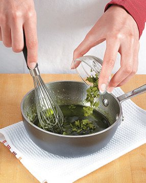 To preserve the color and flavor of the mint, let the glaze cool for a few minutes before adding it.