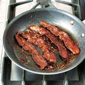 Return cooked bacon to skillet and turn to coat with the brown sugar-chipotle glaze.