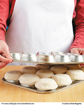 Placing a second muffin pan over the dough helps keep the dough in place while it bakes.