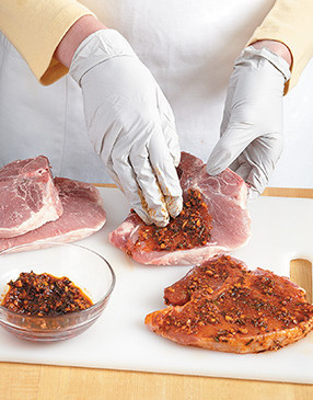 The paprika lends smoky flavor and vivid color to the chops. Press the rub into the meat so it adheres.