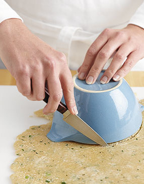 Invert ovenproof bowl onto dough. Use a knife to cut dough around the bowl edge; repeat for other crusts.