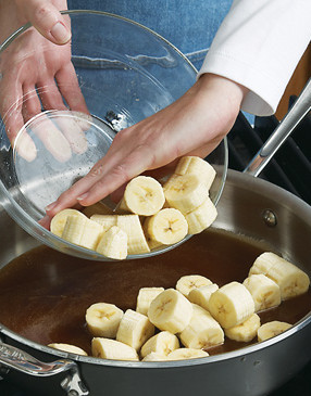 Add bananas to Foster sauce, stirring to coat. Don't cook for long &mdash; you don't want them to get mushy or fall apart.