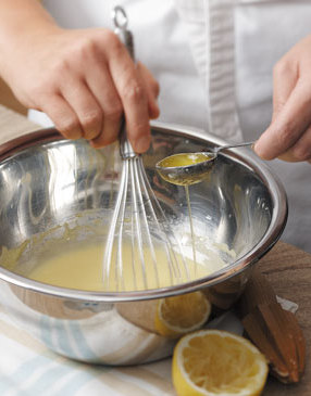 Begin whisking the butter into the egg yolks a drop at a time. This tempers, or brings the egg yolks and the butter to the same temperature. Once the sauce starts to thicken you can add the butter in a thin, steady stream.