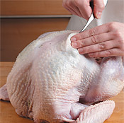 Use a spoon to insert herb butter under the skin, then "massage" it around so it covers the breast.
