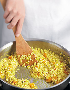 Add more hot liquid to the risotto only after a spoon swiped through the rice leaves clear trails &mdash; an indication the liquid has been fully absorbed.