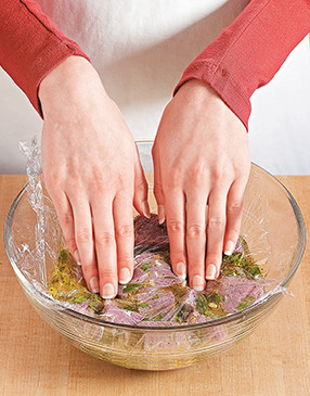 To keep the pork submerged in the marinade, seal it by pressing plastic wrap directly onto the mixture.