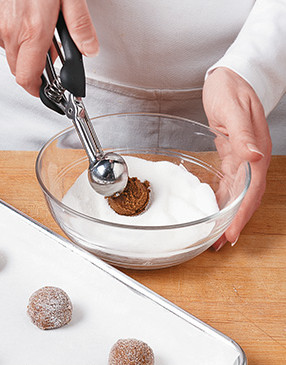 Using a portion scoop helps make cookies with consistent shape and size that bake evenly.