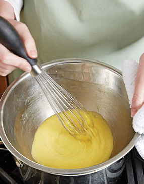 To gently cook the yolks, whisk them with the vinegar reduction in a double boiler until trails begin to appear and yolks thicken.