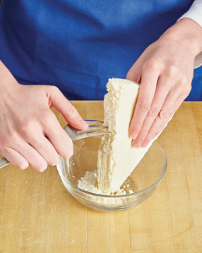 To quickly and easily crumble the Cotija, firmly pull the tines of a fork across the block of cheese.