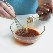 Use a whisk to help incorporate the thick preserves with the whiskey and chipotle chiles.